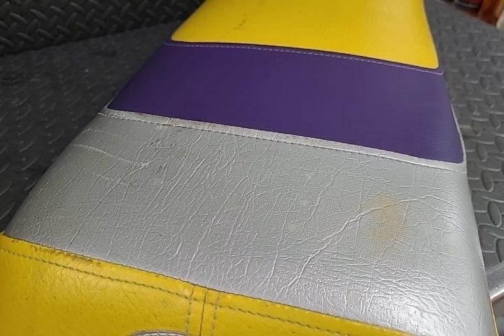 Factory OEM Seat w/ Aftermarket Yellow and Purple Cover *USED*