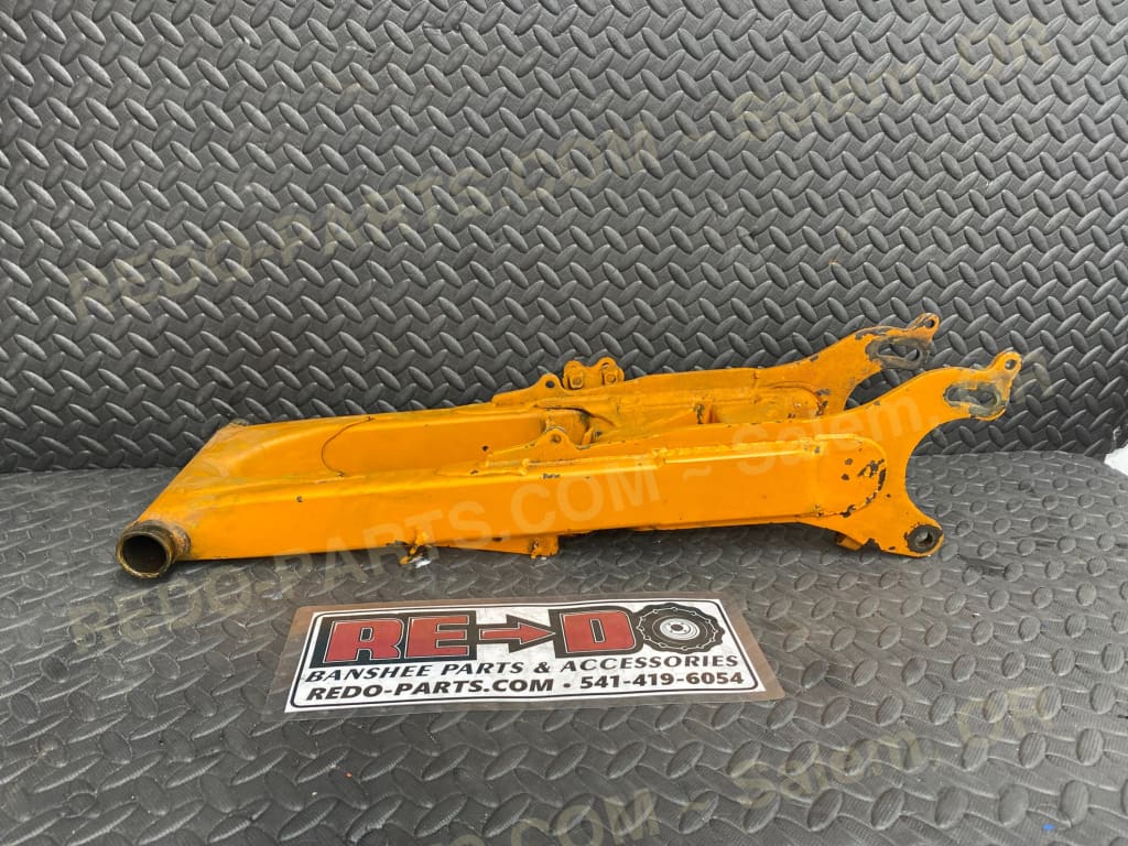Modified OEM Swingarm + 4 Factory Style Carrier Orange *USED* Parts - Used